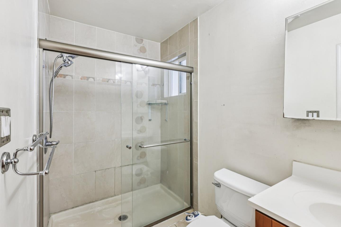 320 Coelho Street Milpitas, CA 95035 - Photo 16 of 34 a bathroom with a shower and toilet
