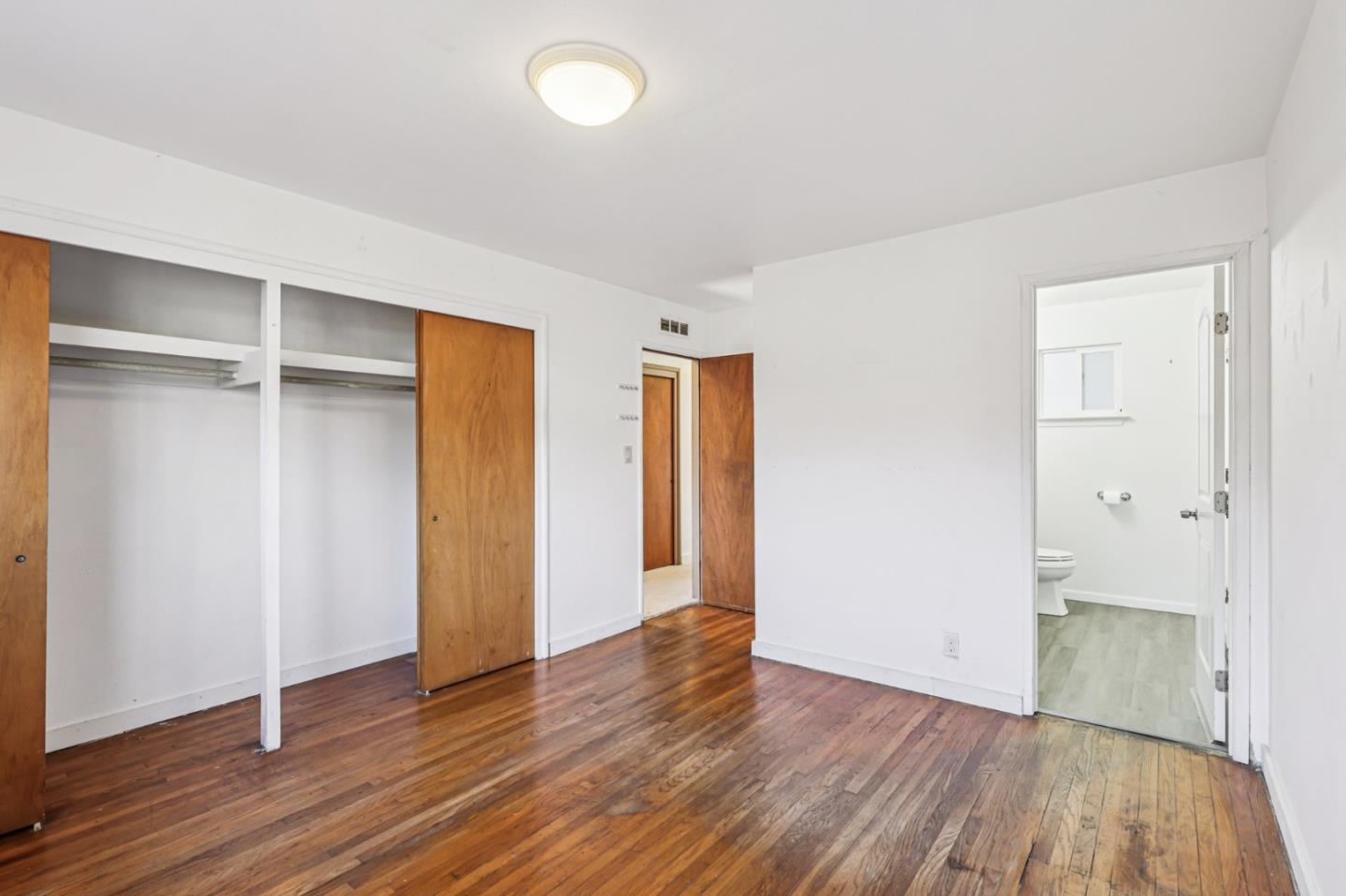 320 Coelho Street Milpitas, CA 95035 - Photo 17 of 34 an empty room with wooden floor and closet
