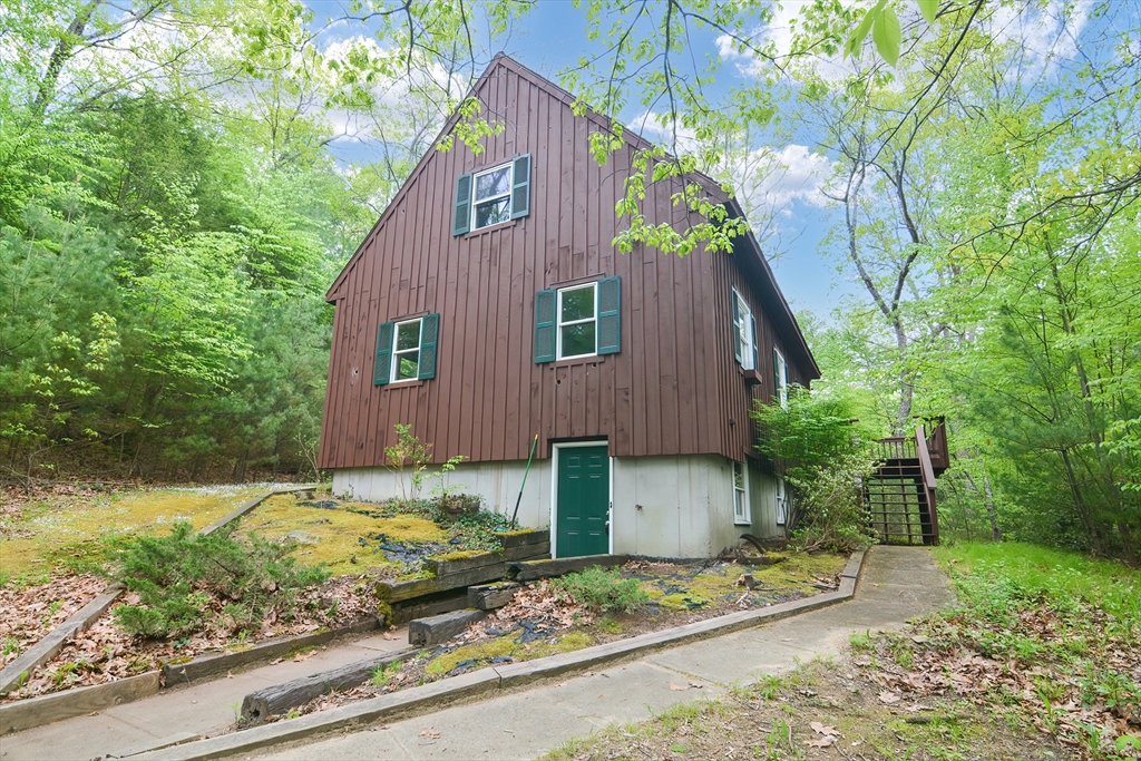 317 Fowler Road Northbridge, MA 01534 - Photo 1 of 40 a view of a yard in front of a house with large tree