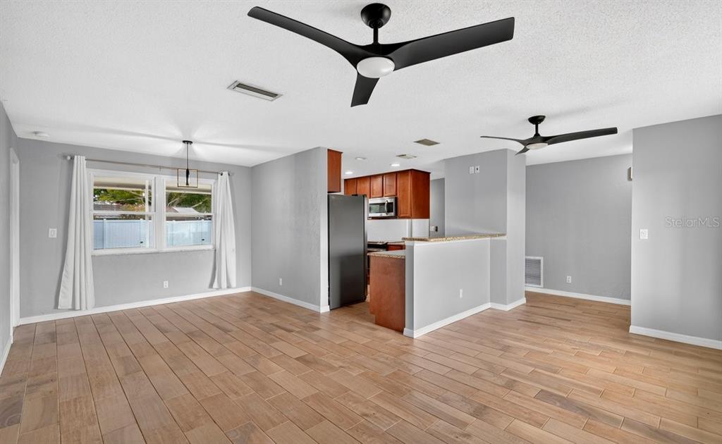 1309 Suwanee Road Daytona Beach, FL 32114 - Photo 7 of 33 a view of a kitchen with a sink and wooden floor
