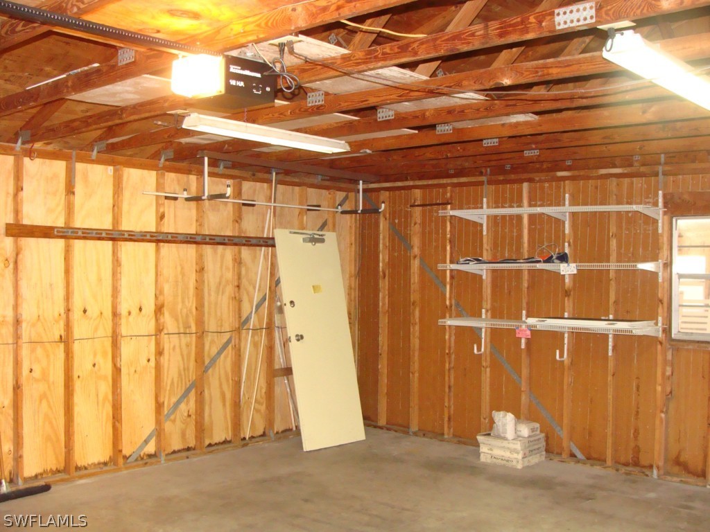 3269 Stringfellow Road St. James City, FL 33956 - Photo 13 of 22 a view of a room with wooden walls