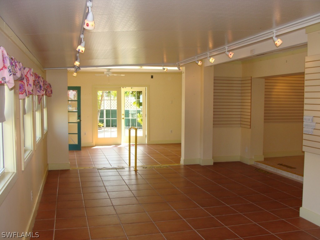 3269 Stringfellow Road St. James City, FL 33956 - Photo 6 of 22 a view of entryway with a door and wooden floor
