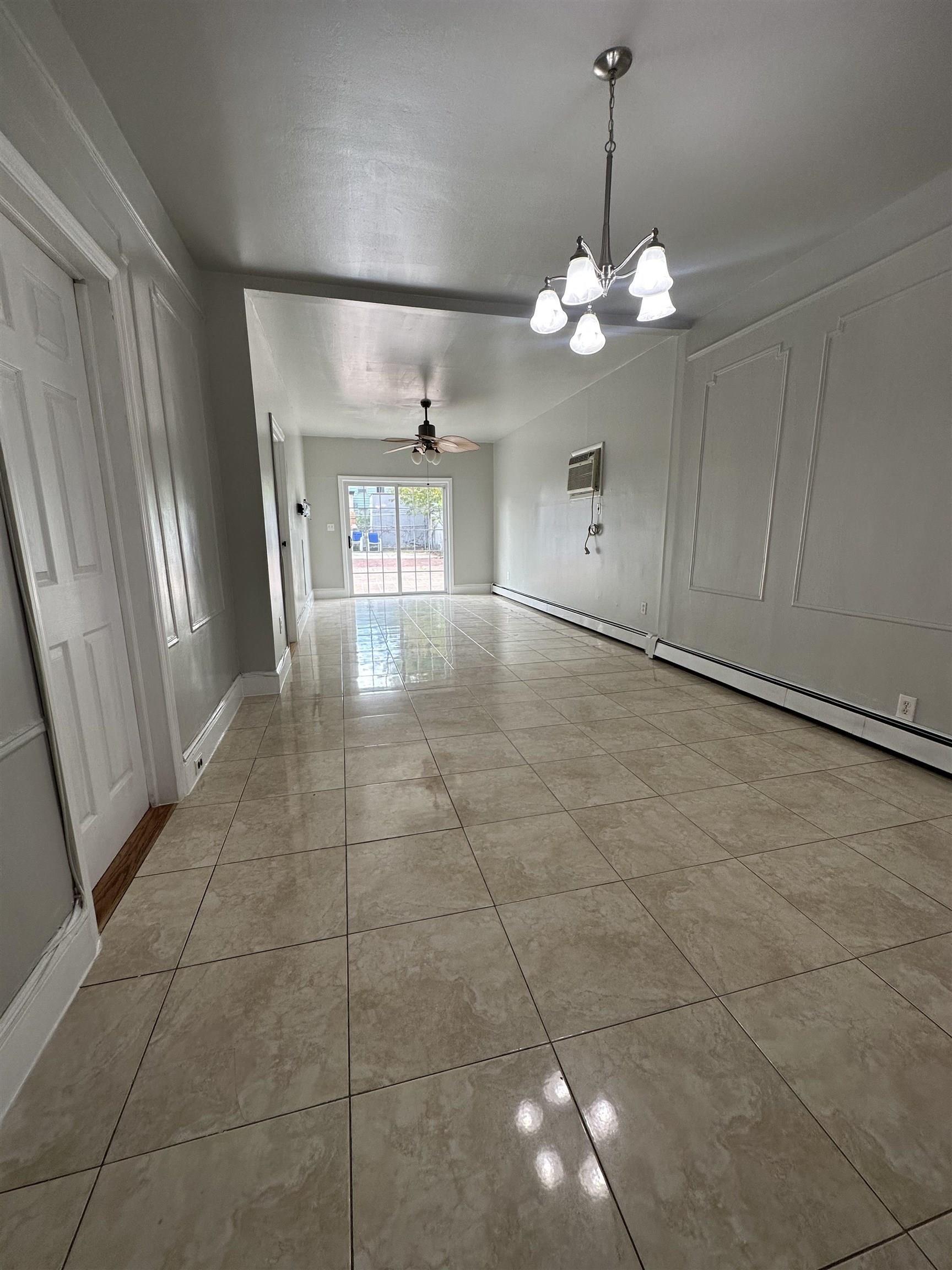172 West 25th Street, Unit 2 Bayonne, NJ 07002 - Photo 5 of 11 a view of a room with an empty space and a window