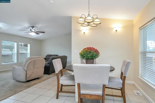 a dining room with furniture and window