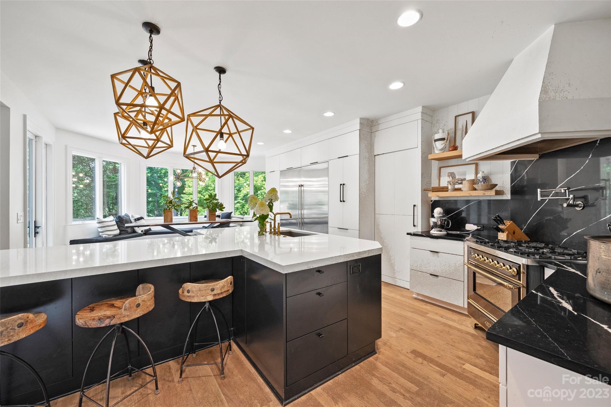 18930 Mary Ardrey Circle Cornelius, NC 28031 - Photo 11 of 48 a kitchen with stainless steel appliances granite countertop a sink and a stove