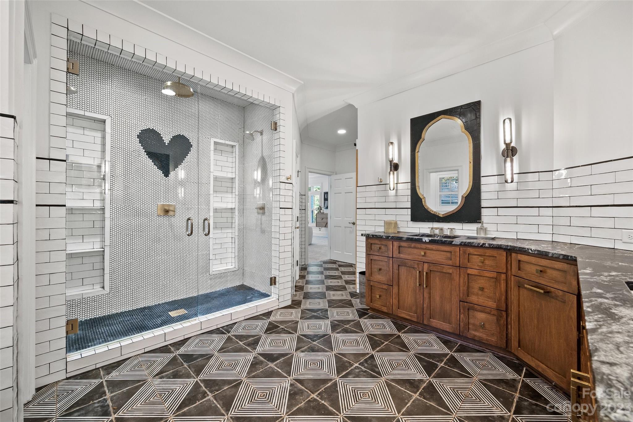 18930 Mary Ardrey Circle Cornelius, NC 28031 - Photo 21 of 48 a bathroom with a double vanity sink mirror and shower