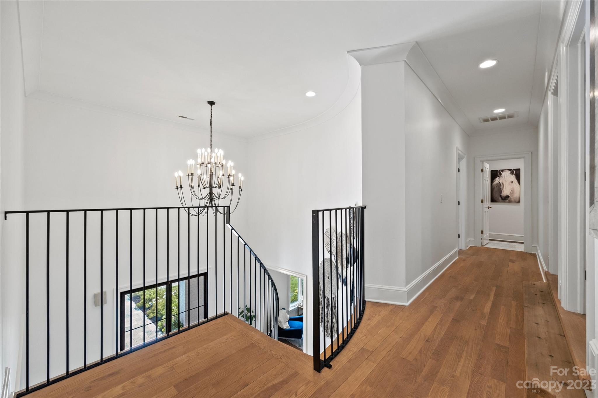 18930 Mary Ardrey Circle Cornelius, NC 28031 - Photo 23 of 48 a view of a hallway with wooden floor and stairs