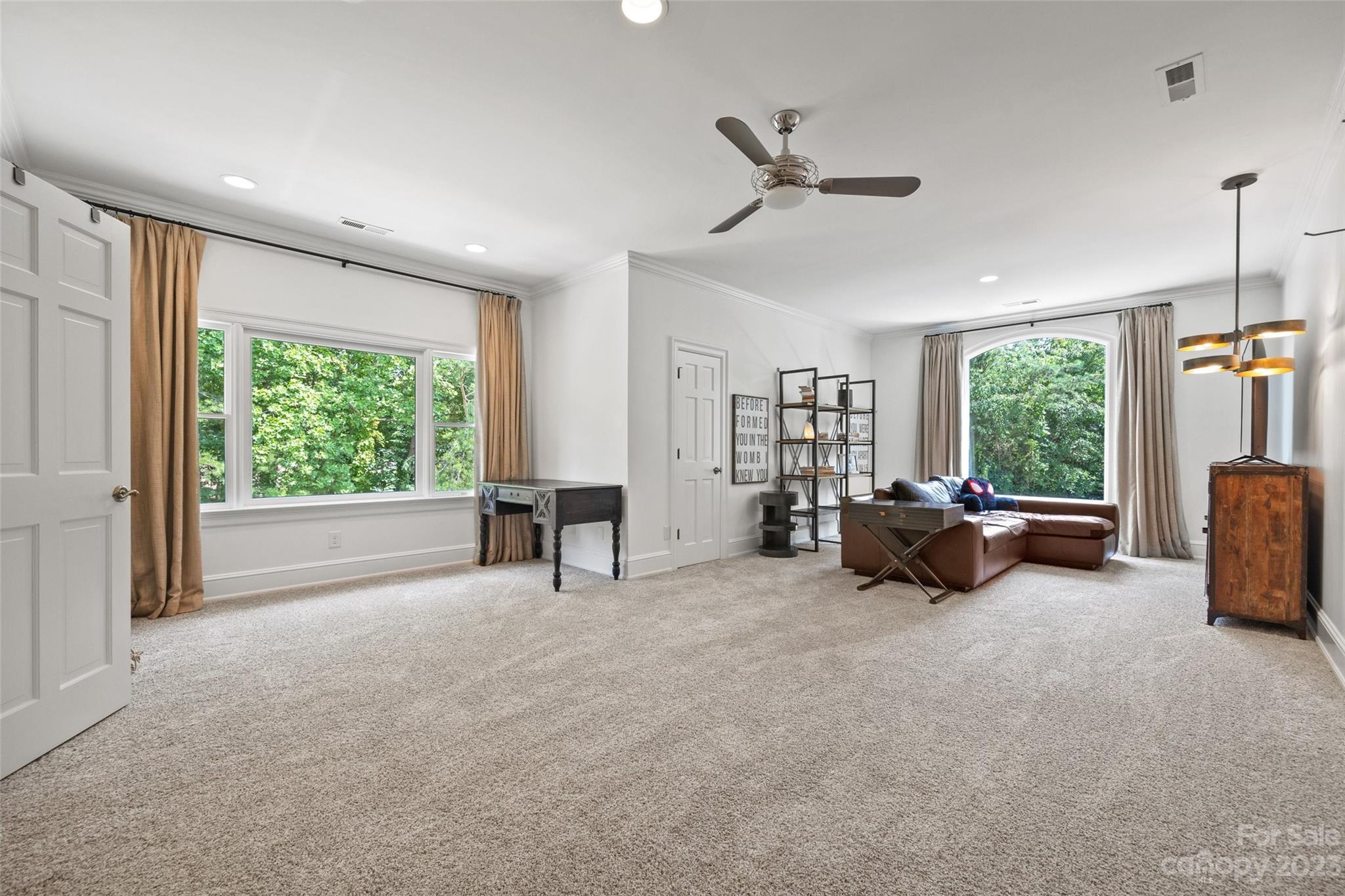 18930 Mary Ardrey Circle Cornelius, NC 28031 - Photo 24 of 48 a view of a livingroom with furniture and a ceiling fan
