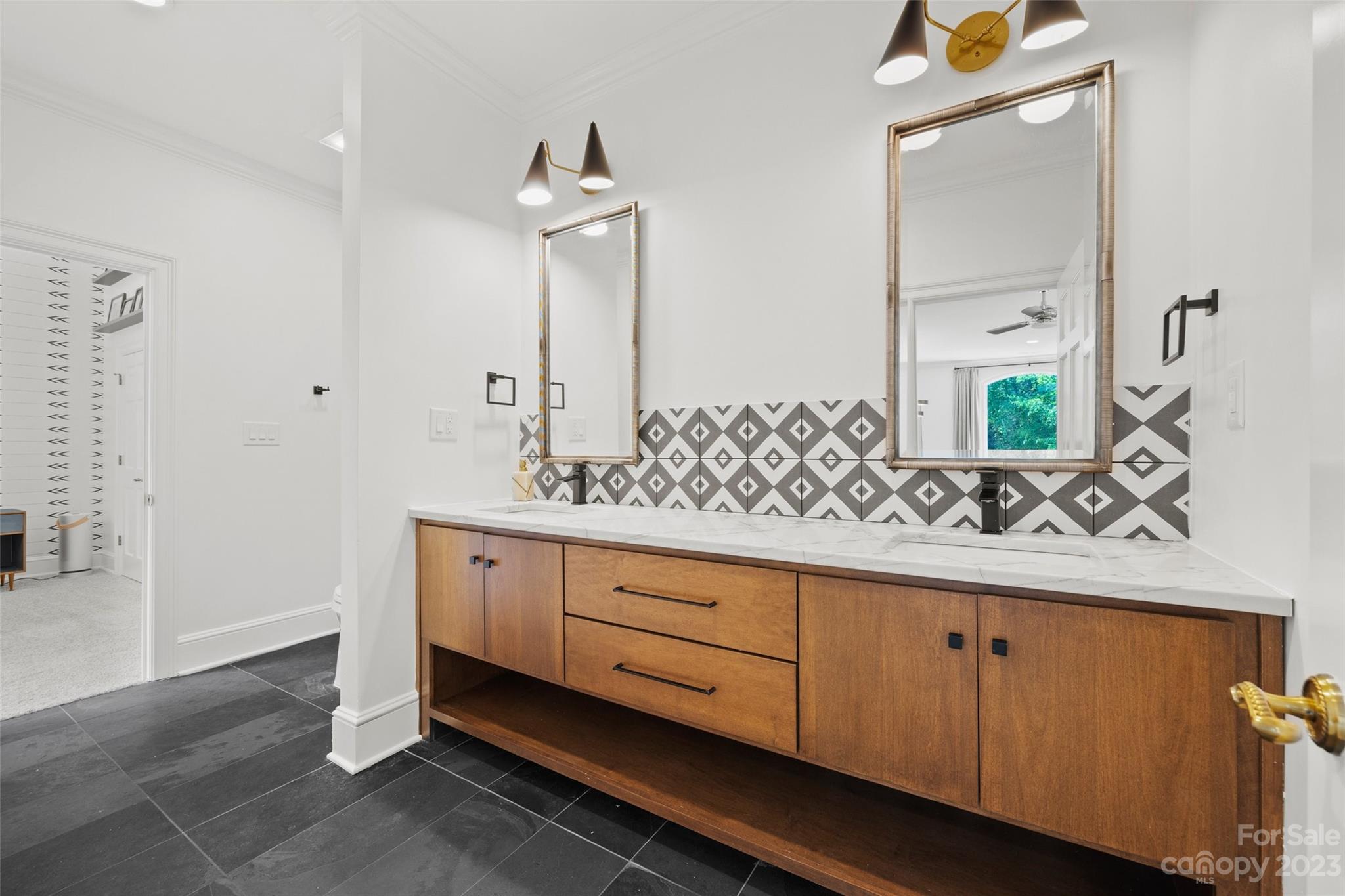 18930 Mary Ardrey Circle Cornelius, NC 28031 - Photo 26 of 48 a bathroom with a double vanity sink and a mirror