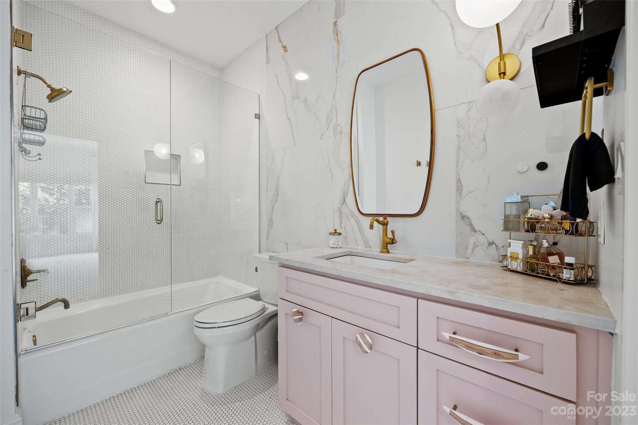 18930 Mary Ardrey Circle Cornelius, NC 28031 - Photo 28 of 48 a bathroom with a double vanity sink toilet mirror and shower