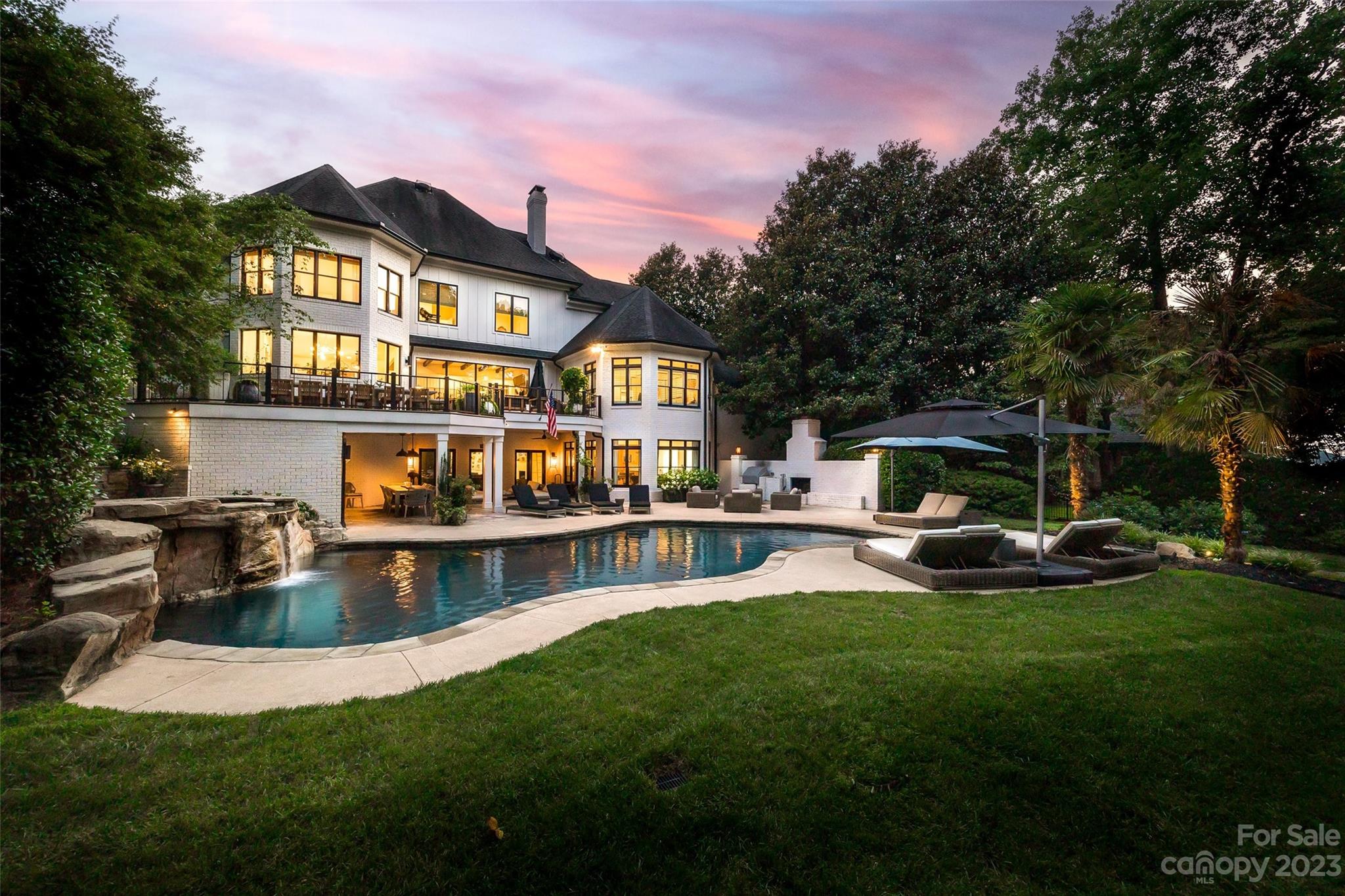 18930 Mary Ardrey Circle Cornelius, NC 28031 - Photo 3 of 48 a view of a house with a swimming pool and sitting area