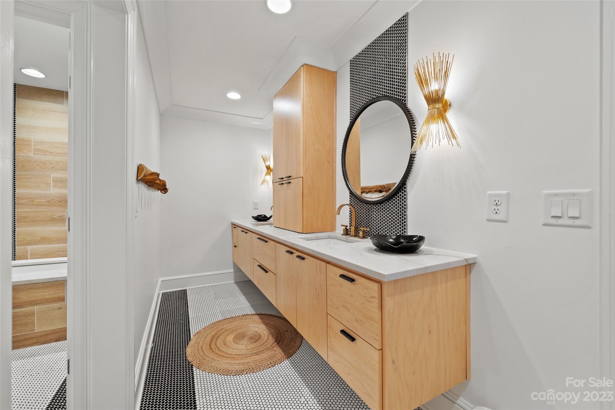 18930 Mary Ardrey Circle Cornelius, NC 28031 - Photo 31 of 48 a bathroom with a sink a toilet and a mirror