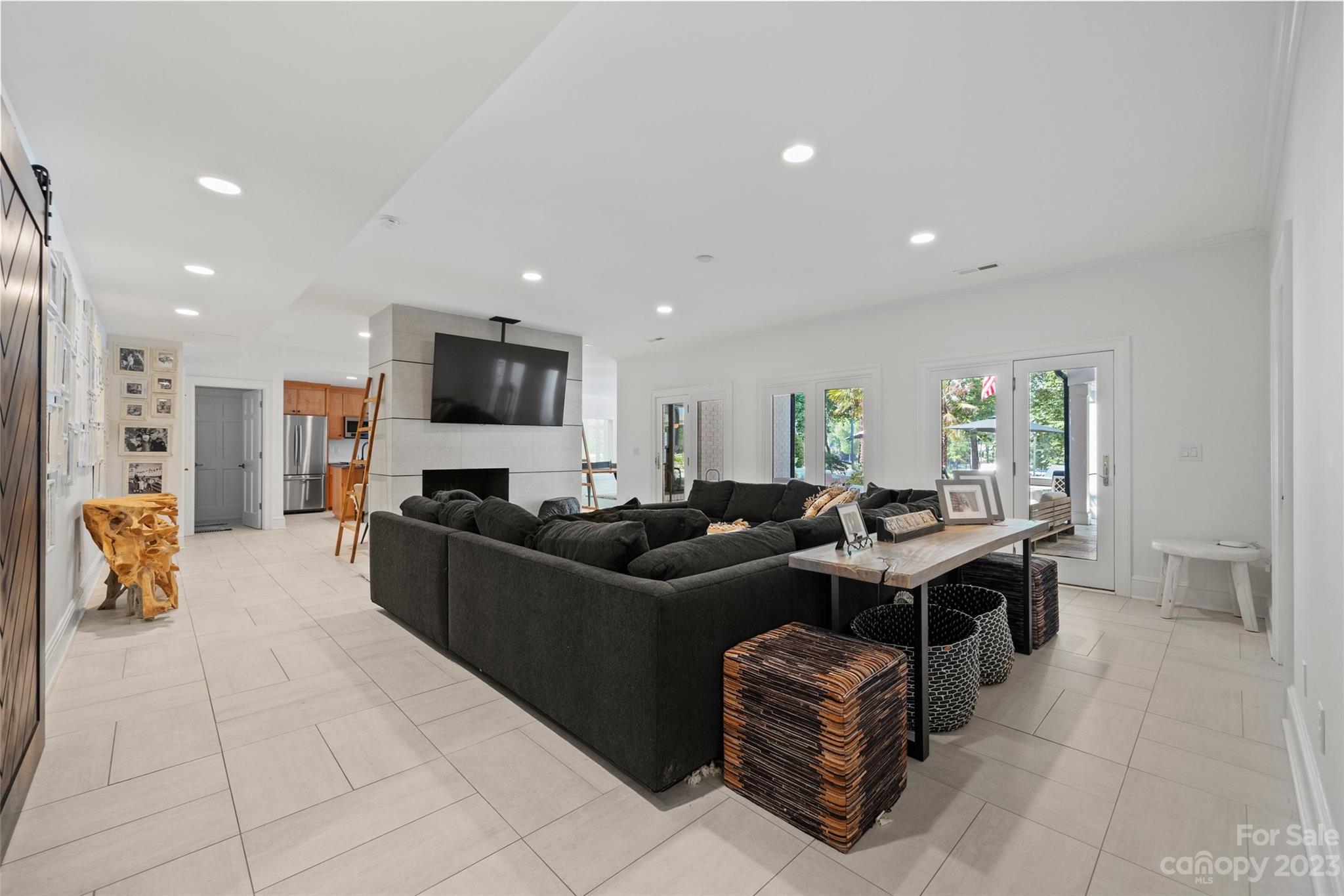 18930 Mary Ardrey Circle Cornelius, NC 28031 - Photo 32 of 48 a living room with furniture and a flat screen tv