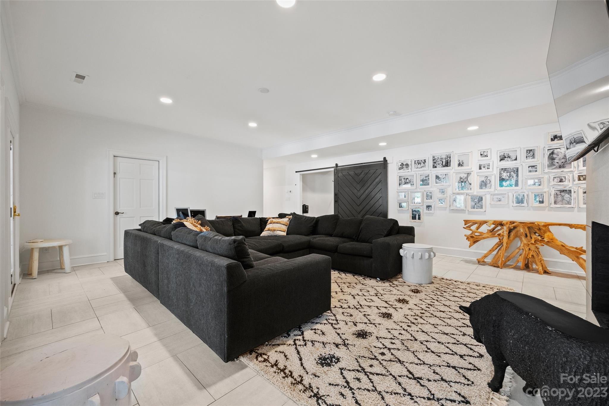 18930 Mary Ardrey Circle Cornelius, NC 28031 - Photo 33 of 48 a living room with furniture and a flat screen tv
