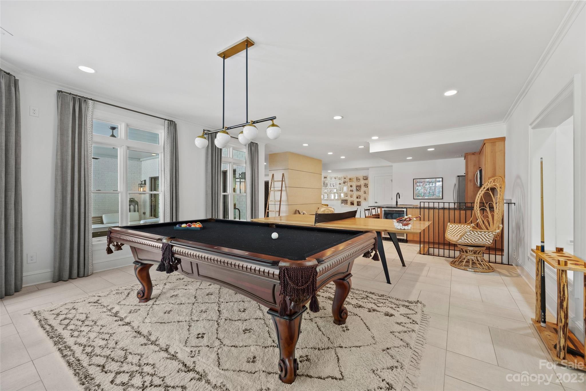18930 Mary Ardrey Circle Cornelius, NC 28031 - Photo 36 of 48 a room with table chairs and a chandelier