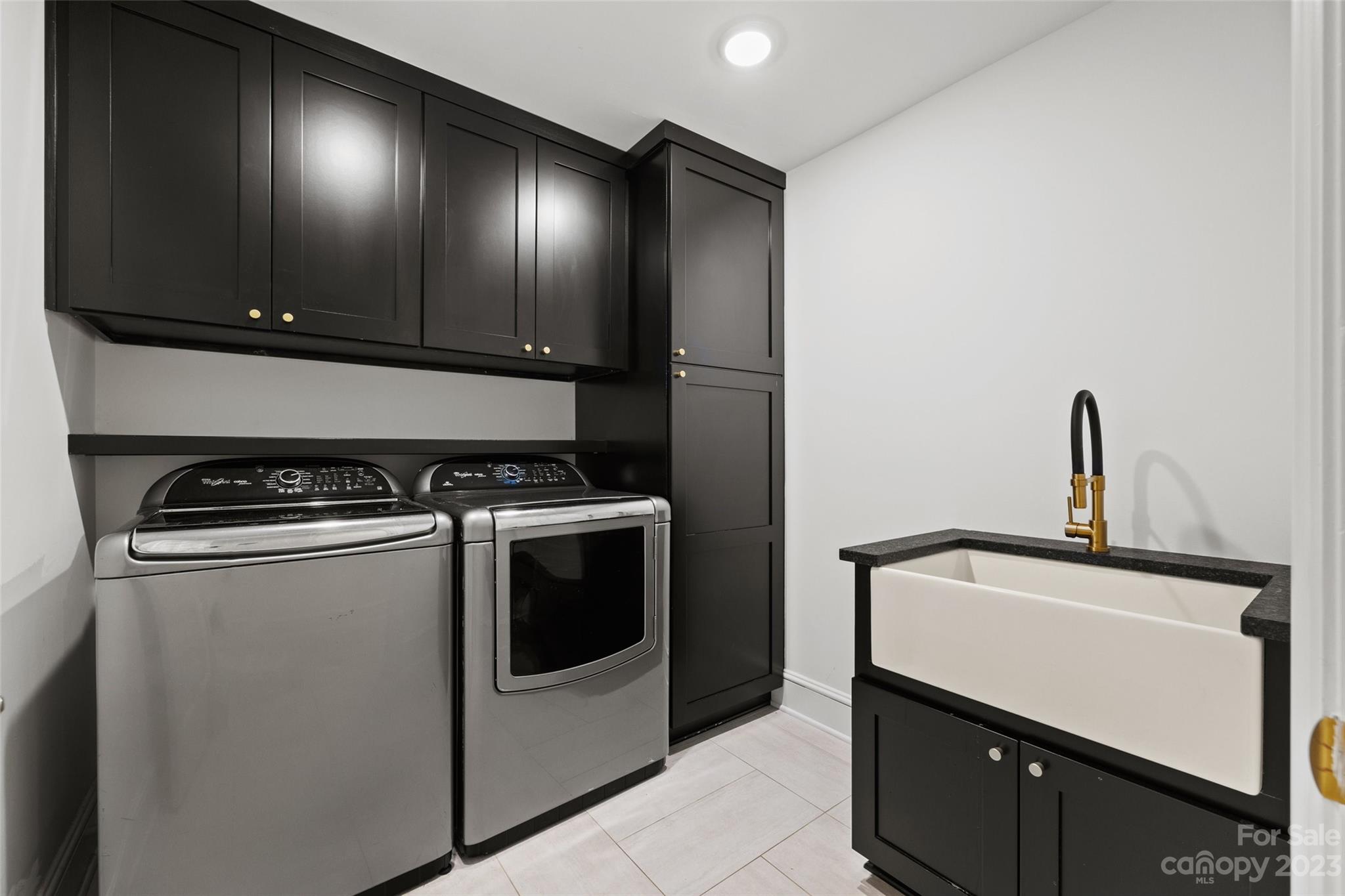 18930 Mary Ardrey Circle Cornelius, NC 28031 - Photo 38 of 48 a kitchen with a stove and a sink