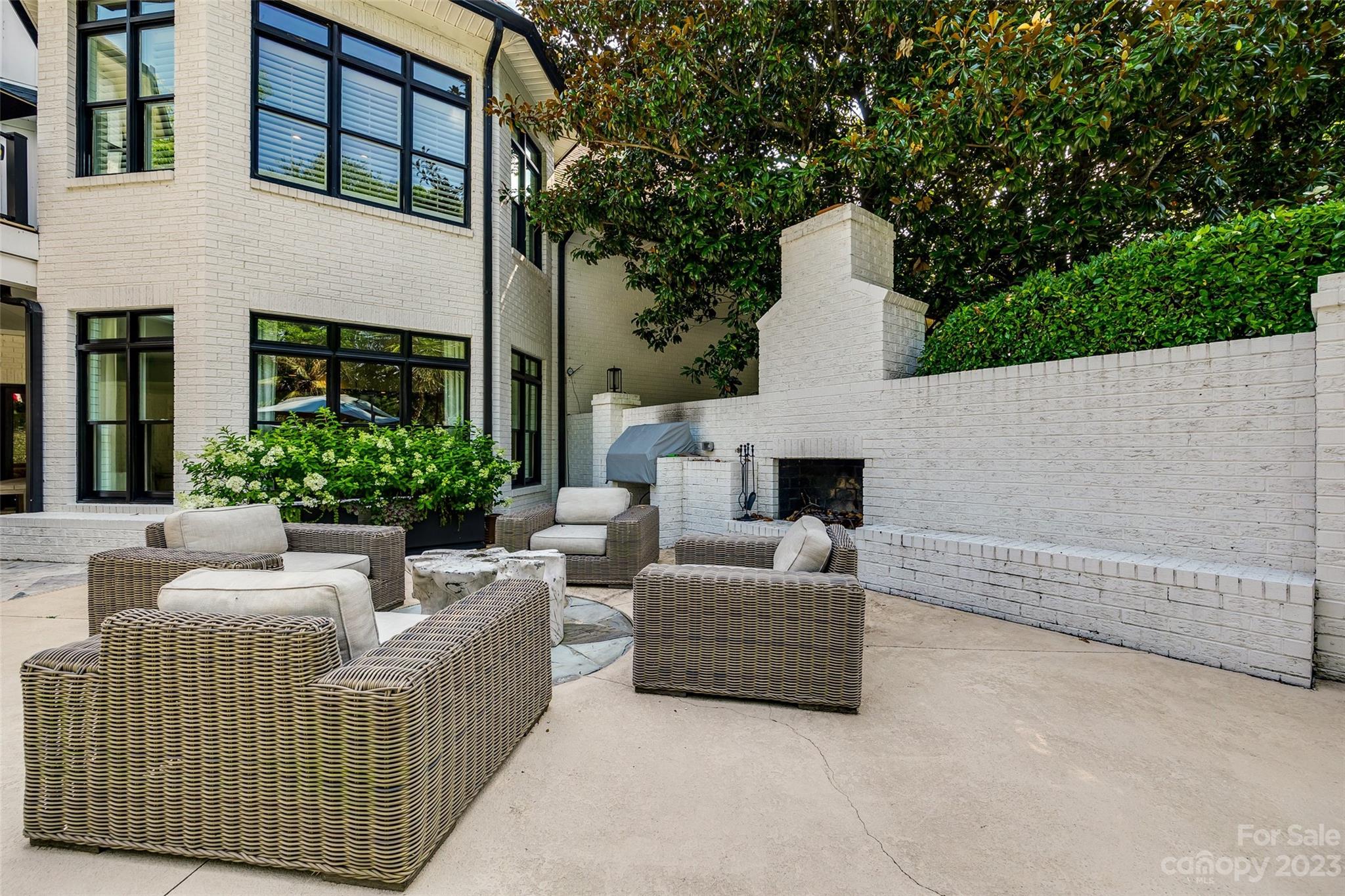 18930 Mary Ardrey Circle Cornelius, NC 28031 - Photo 42 of 48 a view of a patio with couches and potted plants