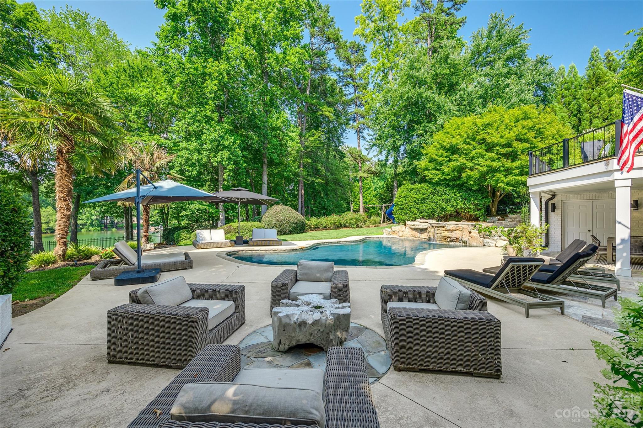 18930 Mary Ardrey Circle Cornelius, NC 28031 - Photo 46 of 48 a view of a patio with couches and swimming pool
