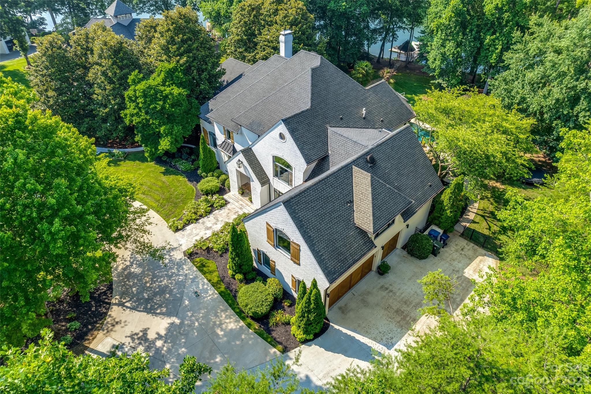 18930 Mary Ardrey Circle Cornelius, NC 28031 - Photo 48 of 48 an aerial view of a house with a yard and trees all around