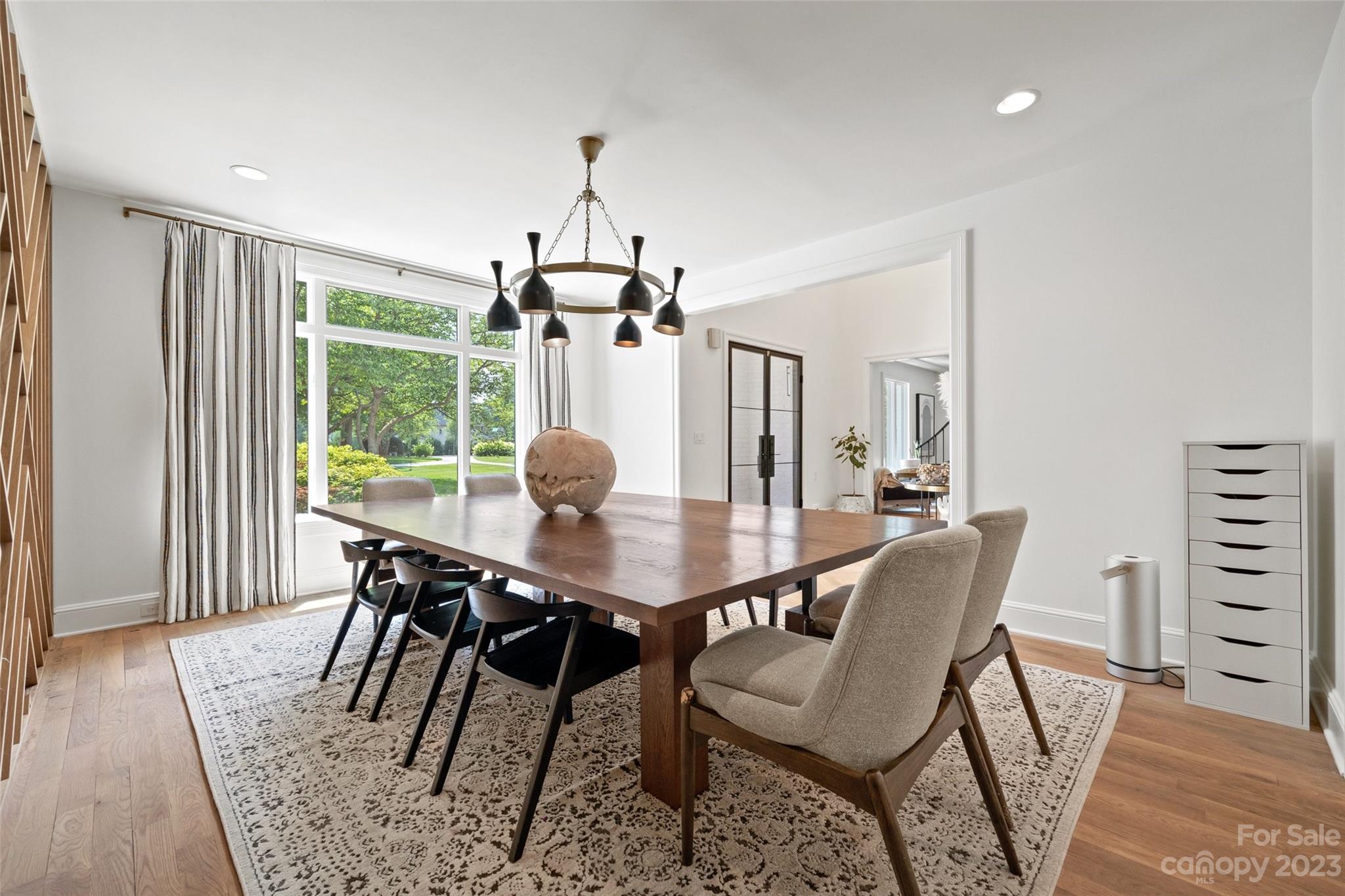 18930 Mary Ardrey Circle Cornelius, NC 28031 - Photo 8 of 48 a view of a dining room with furniture window and wooden floor
