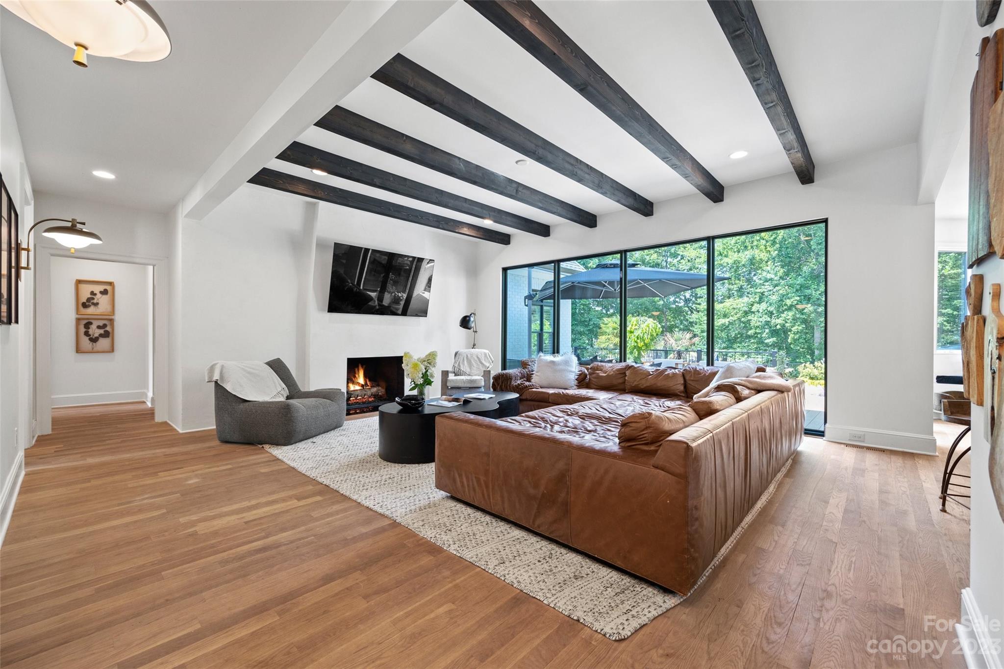 18930 Mary Ardrey Circle Cornelius, NC 28031 - Photo 9 of 48 a living room with furniture fireplace and a large window