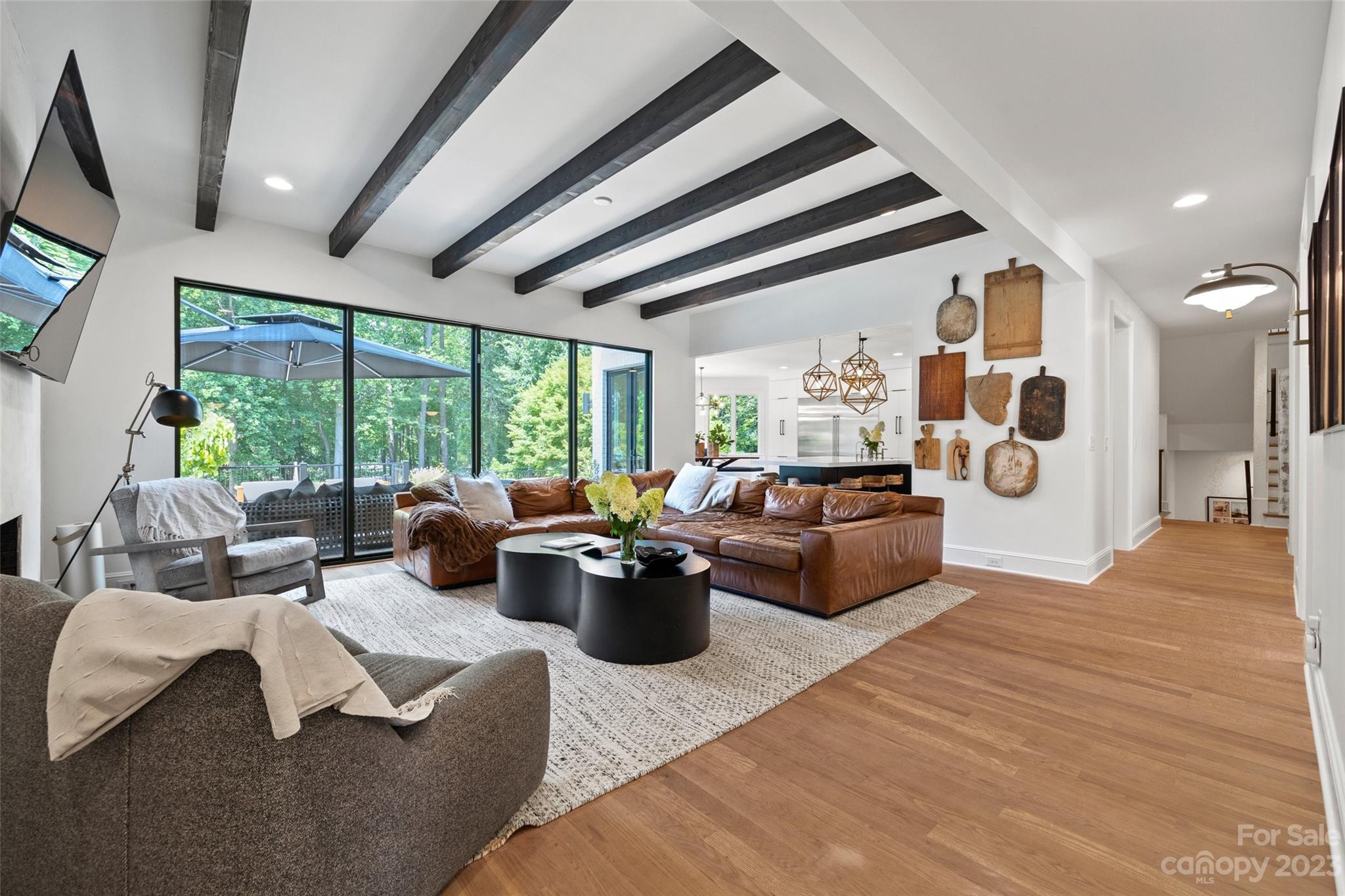 18930 Mary Ardrey Circle Cornelius, NC 28031 - Photo 10 of 48 a living room with furniture and a large window
