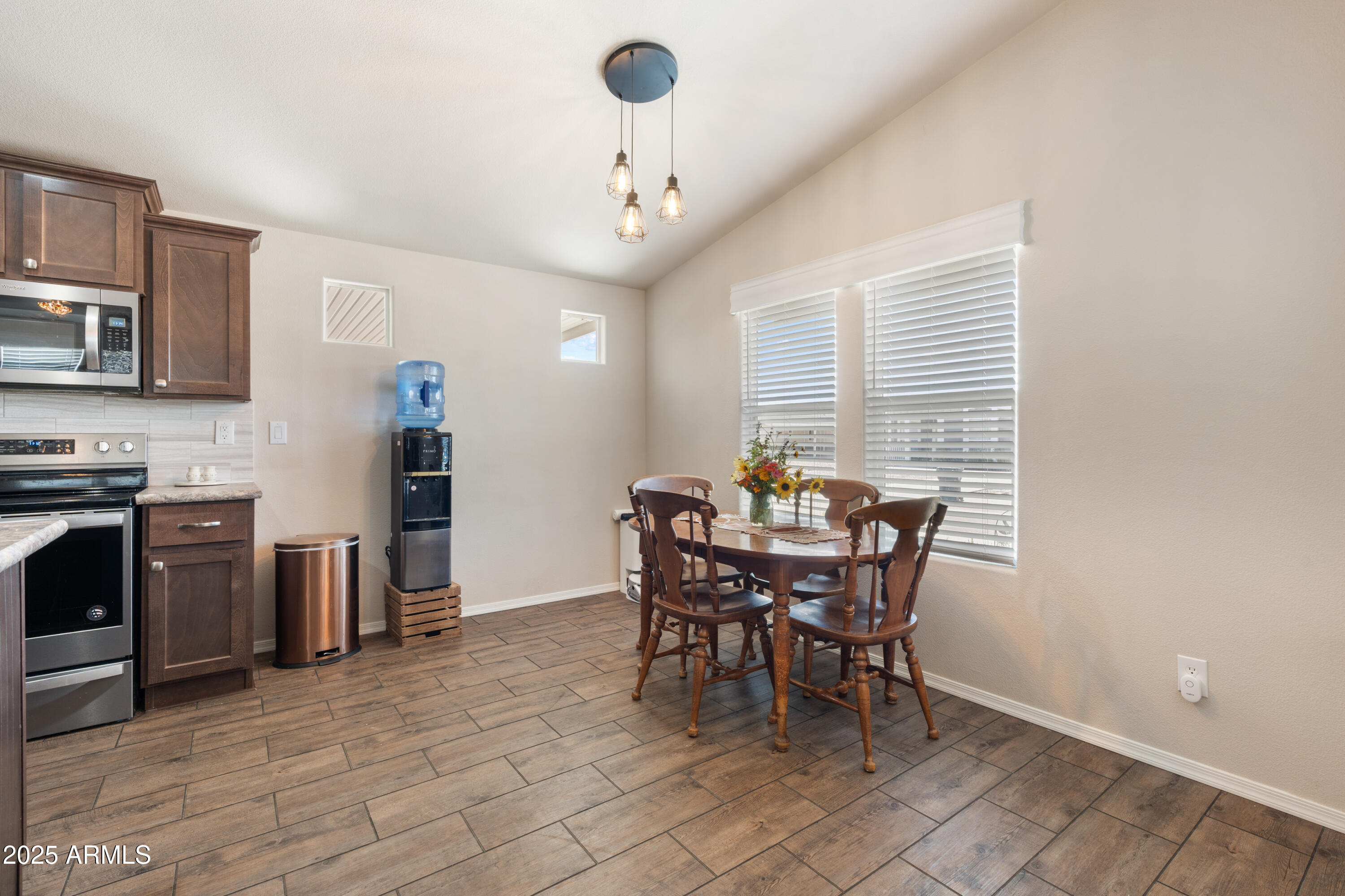 1174 Wheeler Road Camp Verde, AZ 86322 - Photo 11 of 23 a view of a dining room with furniture and a chandelier