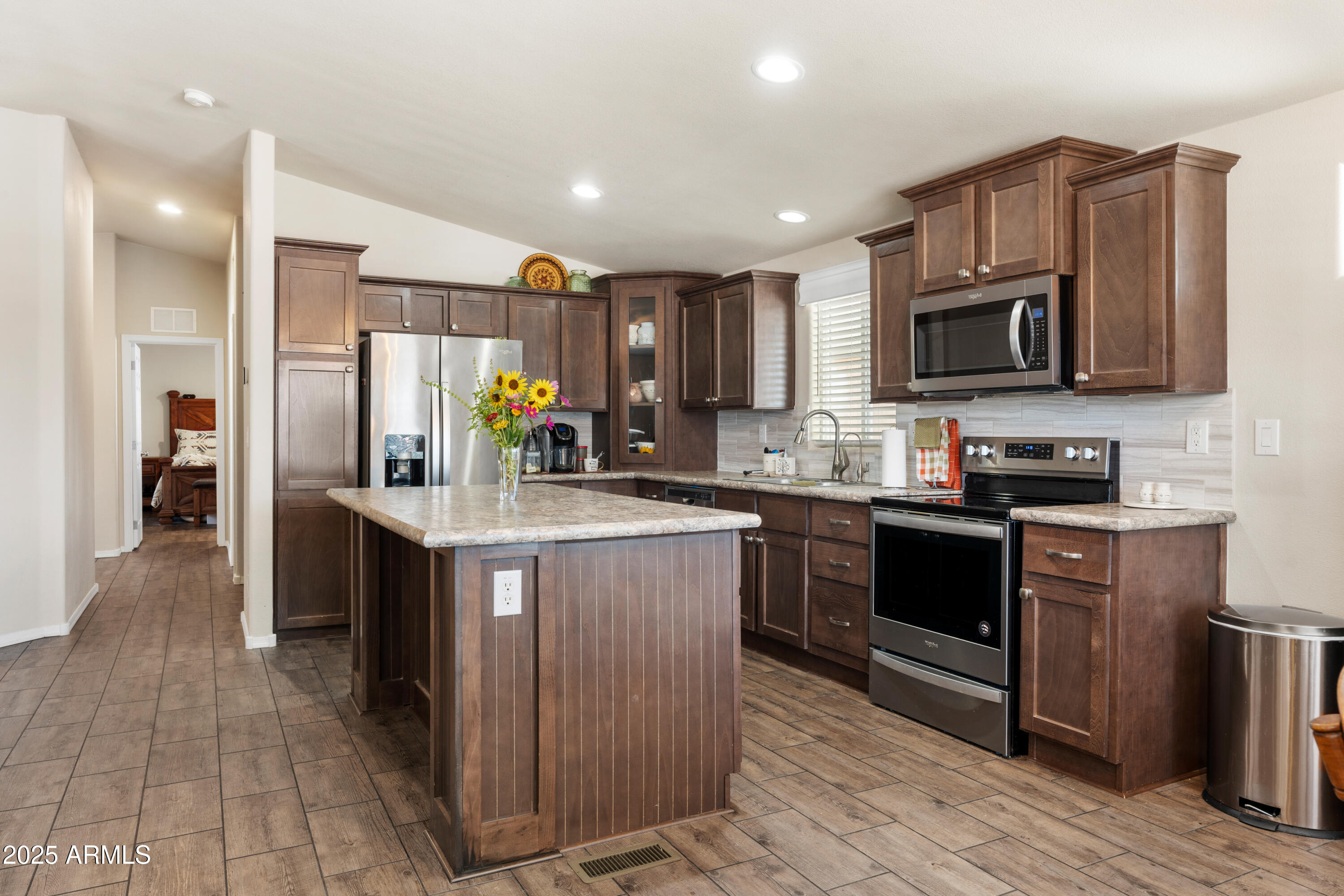 1174 Wheeler Road Camp Verde, AZ 86322 - Photo 2 of 23 a kitchen with stainless steel appliances granite countertop a refrigerator stove and sink