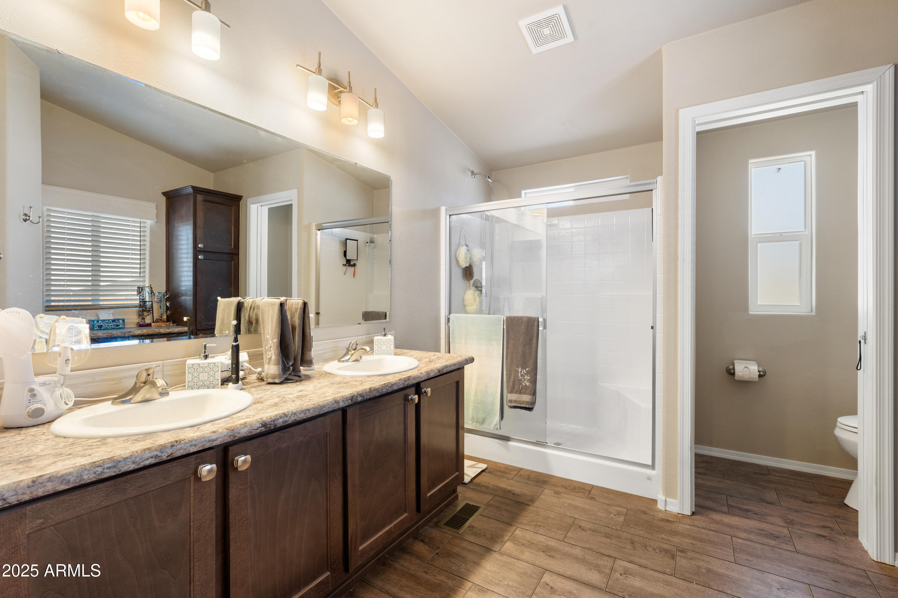1174 Wheeler Road Camp Verde, AZ 86322 - Photo 6 of 23 a bathroom with a double vanity sink mirror and shower