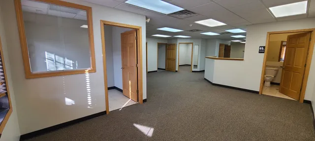 a view of a hallway with seating area
