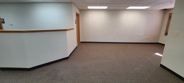 a view of a room with a hallway
