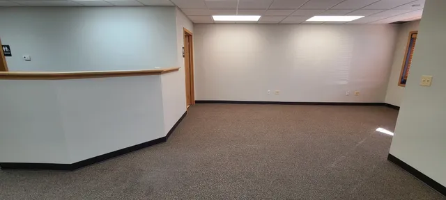 a view of a room with a hallway