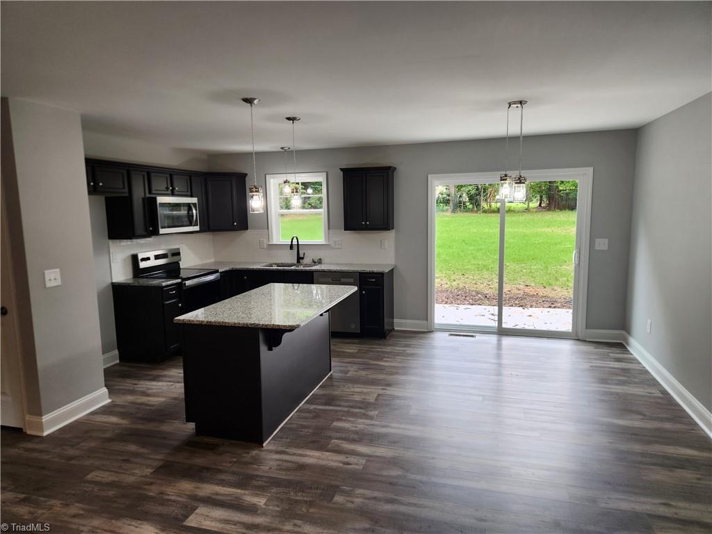 220 Longview Road Madison, NC 27025 - Photo 3 of 10 Kitchen and Dining Area View from Living Room