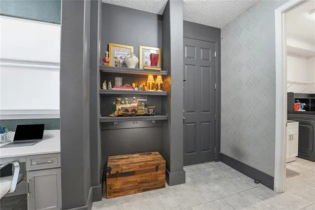 a bathroom with a granite countertop sink a toilet and shower