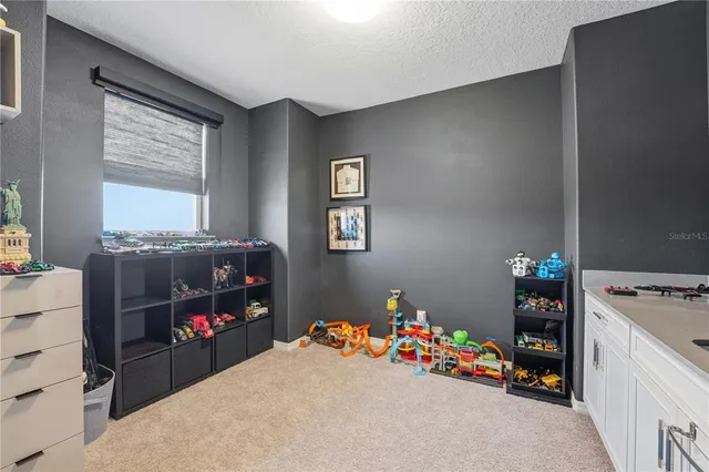 a spacious en suite bathroom with double sink and a mirror