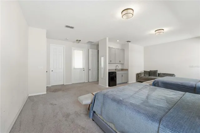 a bathroom with a sink a vanity and a mirror