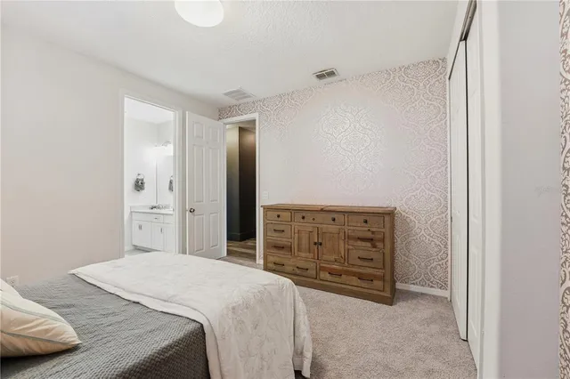 a backyard of a house with barbeque oven and outdoor seating