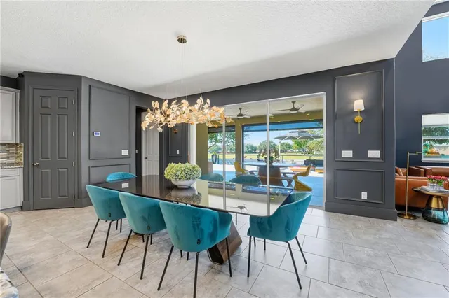a kitchen with a table and chairs