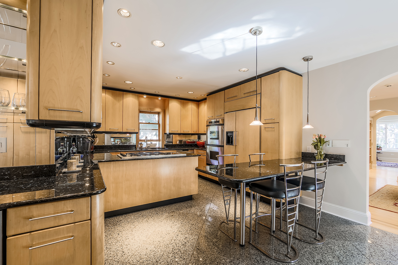 212 Stanley Avenue Park Ridge, IL 60068 - Photo 8 of 33 a kitchen with kitchen island granite countertop lots of counter top space and stainless steel appliances