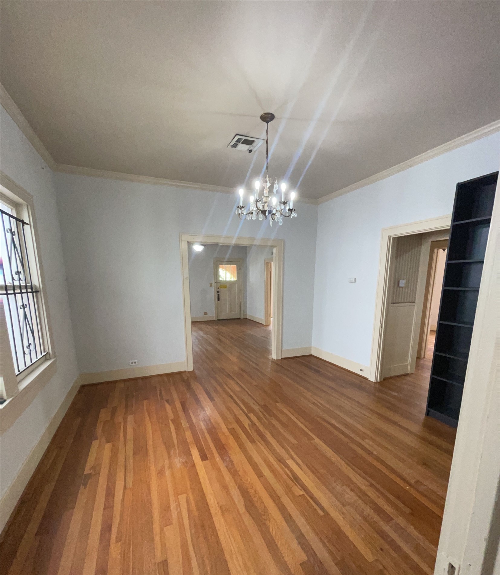 4716 Crawford Street Houston, TX 77004 - Photo 2 of 14 wooden floor in an empty room with a window