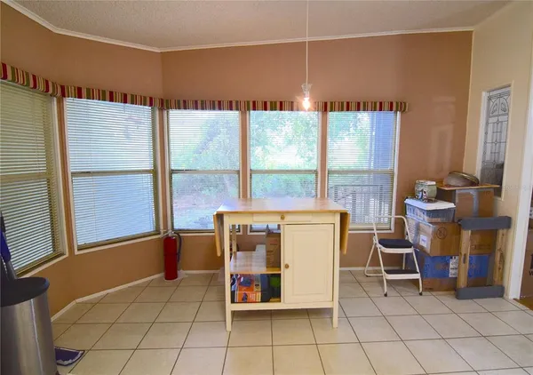 a room with chairs and window