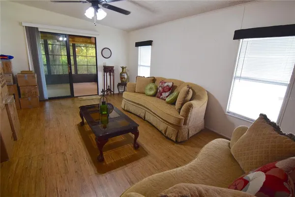 a living room with furniture and a large window