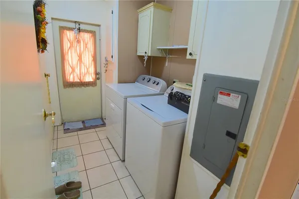 a utility room with a window dryer and washer