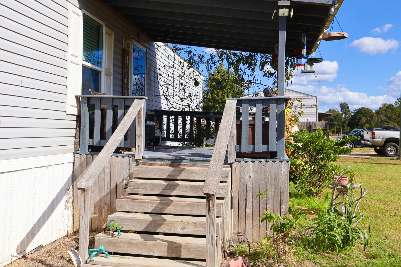 21625 County Road 3749D Cleveland, TX 77327 - Photo 4 of 20 a view of balcony with wooden floor and potted plants