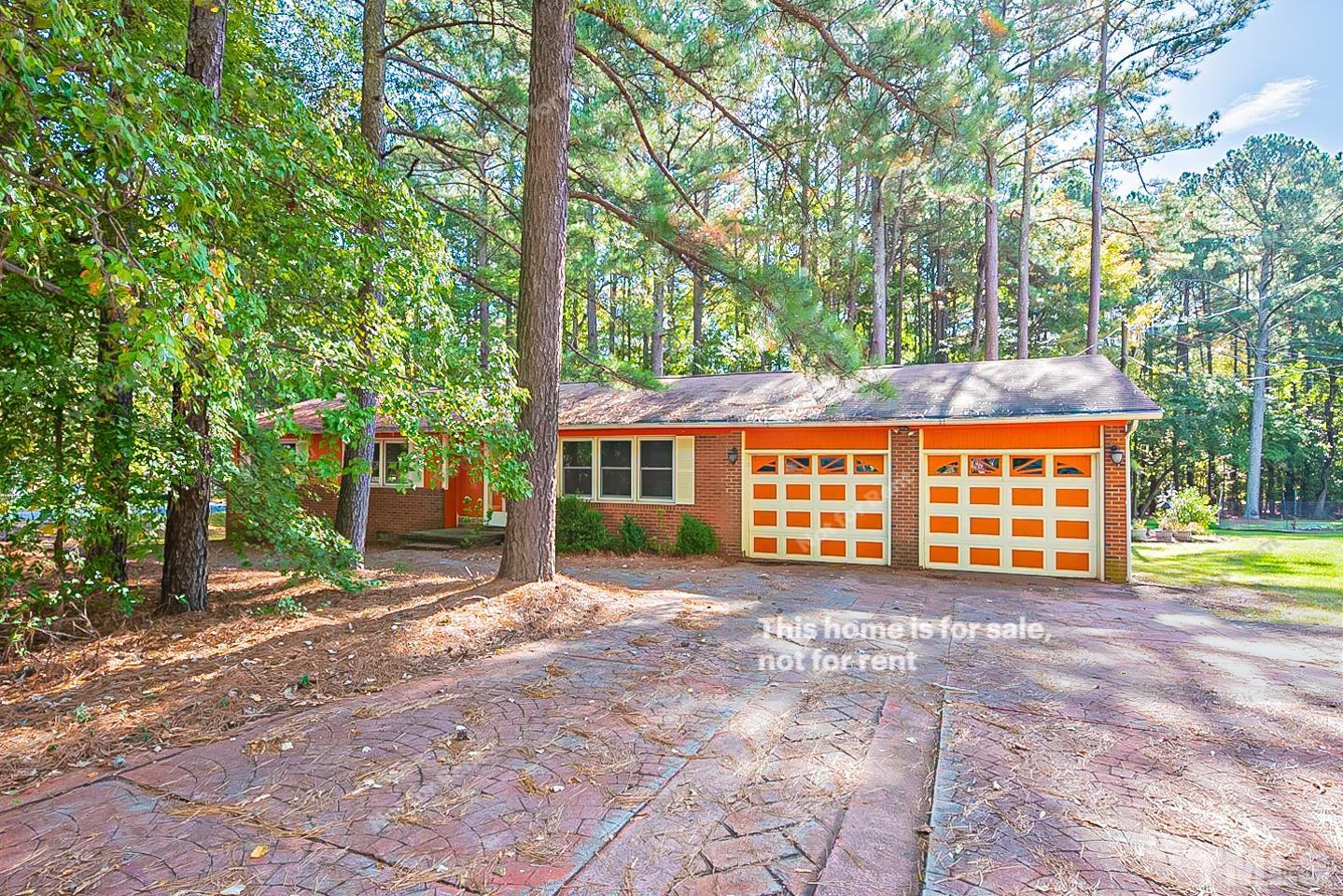4903 Fayetteville Road Durham, NC 27713 - Photo 1 of 19 a view of a house with large trees and next to a yard