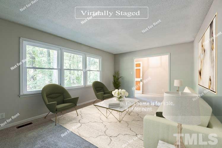 4903 Fayetteville Road Durham, NC 27713 - Photo 2 of 19 a living room with furniture and a window