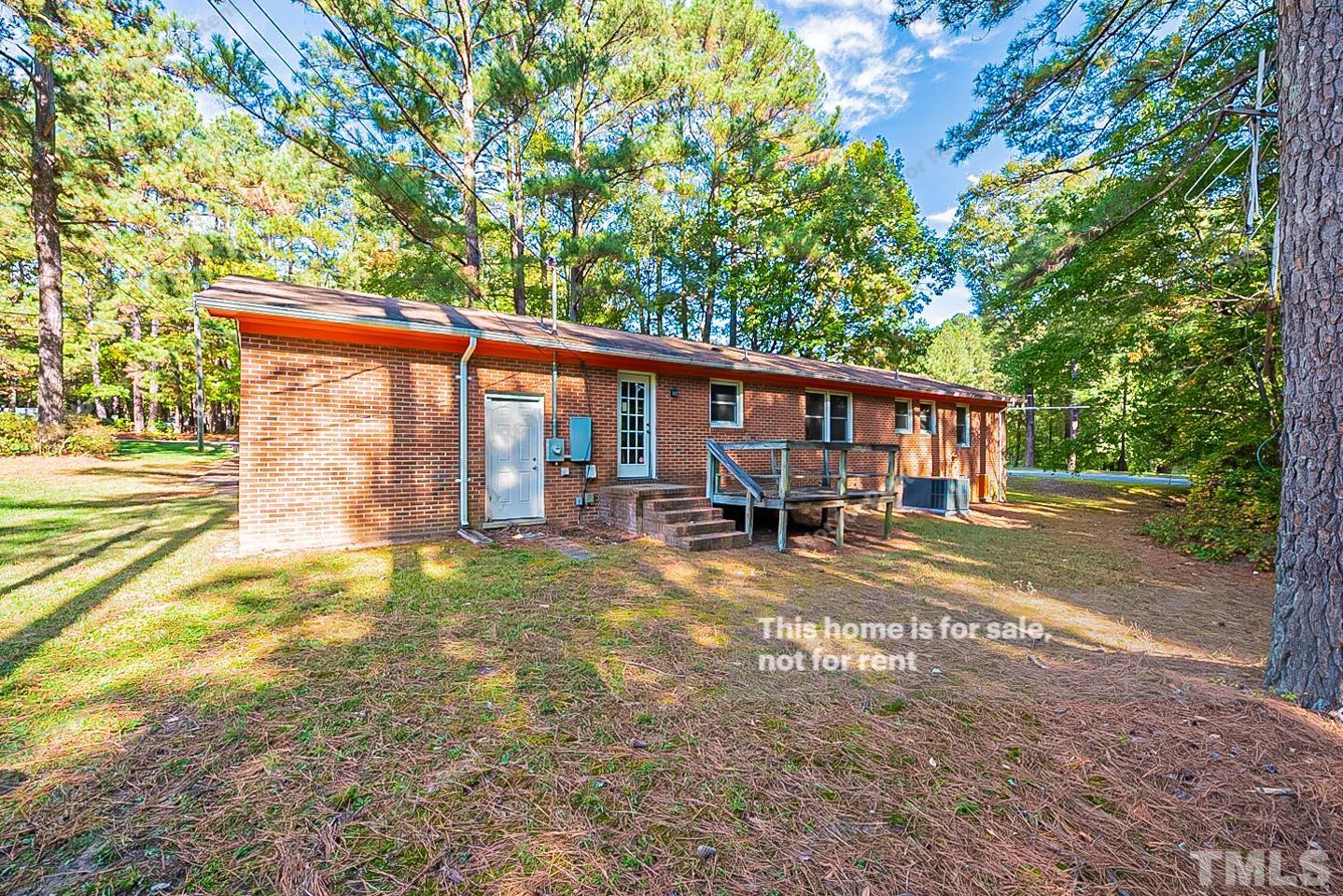 4903 Fayetteville Road Durham, NC 27713 - Photo 17 of 19 a view of a house with backyard and sitting area