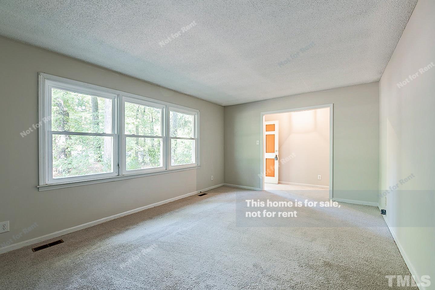 4903 Fayetteville Road Durham, NC 27713 - Photo 3 of 19 an empty room with windows