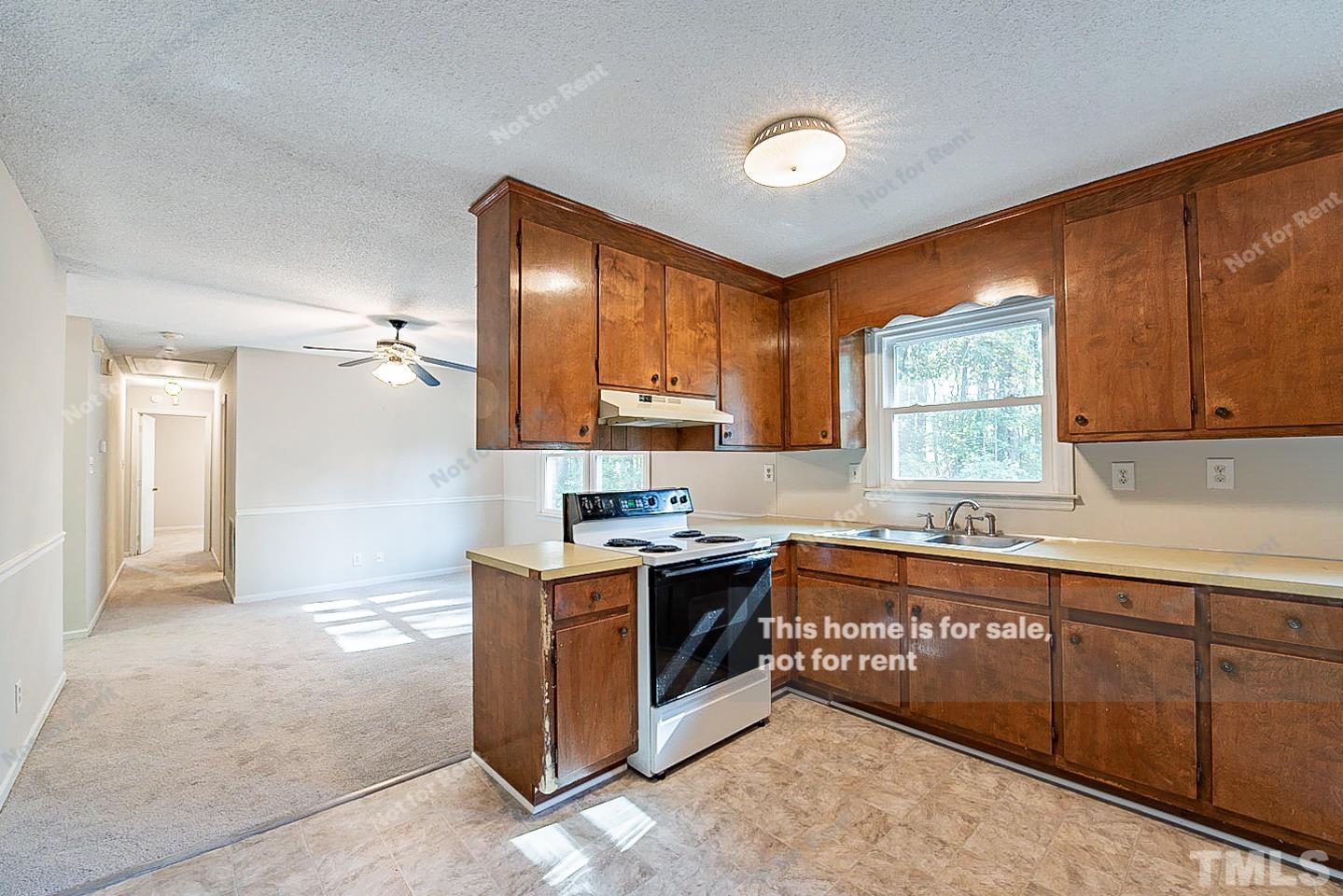 4903 Fayetteville Road Durham, NC 27713 - Photo 6 of 19 a kitchen with stainless steel appliances granite countertop a sink and cabinets