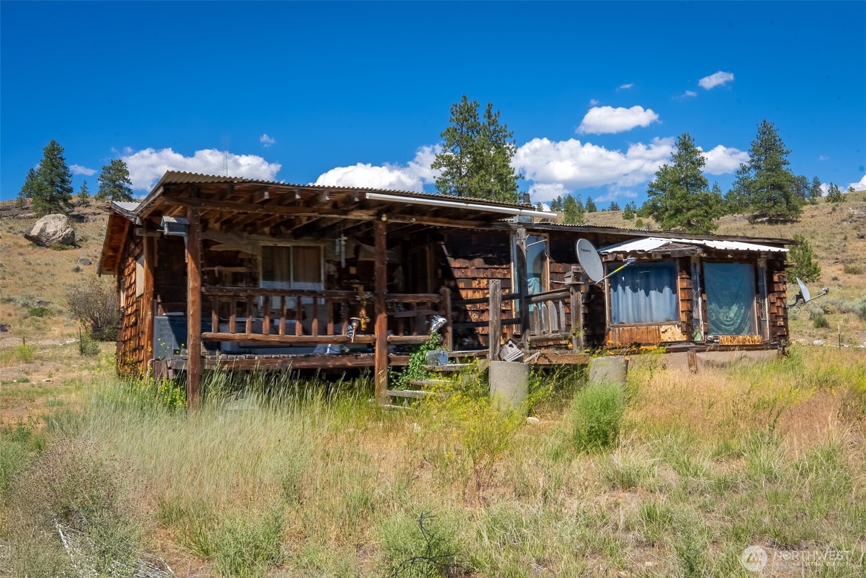 a view of a house with swimming pool and porch